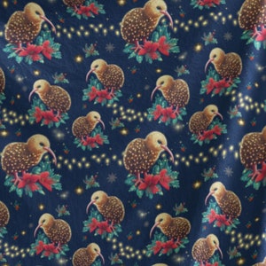 May include: A blue fleece blanket with a repeating pattern of brown kiwi birds wearing red bows and surrounded by green leaves and white lights.