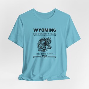 Wyoming Cowgirl T-Shirt Girl Power Gift for Her Equality State WY Horse Lover T Shirt Vintage Vibes Unisex Jersey Short Sleeve Tee Turquoise