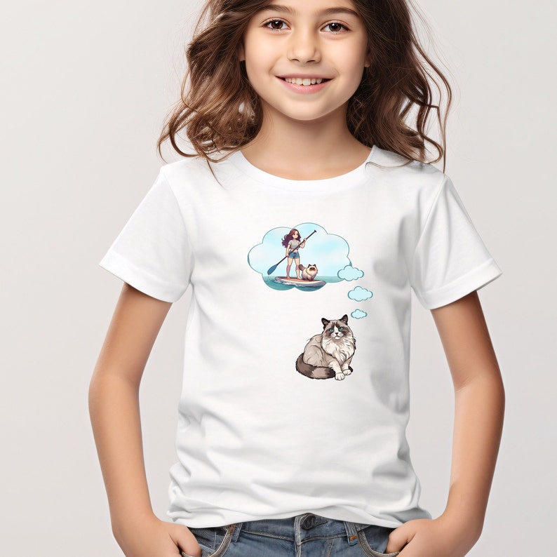 This short sleeve T-Shirt features a Ragdoll Cat with a thought bubble and inside the big thought bubble is an anime style girl on a paddleboard with the cat on front. The large design is centered on the front of the T-Shirt.