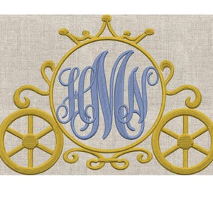 May include: An embroidered design of a fairytale carriage in gold and blue. The carriage features two wheels, a circular frame with a crown, and a monogram in blue. The background is a neutral beige fabric.