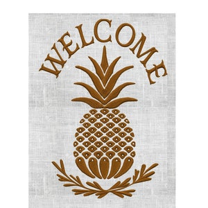 May include: A brown embroidered welcome sign with a pineapple and leaves. The text "WELCOME" is in a curved arc above the pineapple.