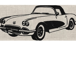May include: Black and white embroidered design of a classic convertible car. The car features a black top, wheels, and accents, with the year "1964" visible on the front. The design is on a neutral-colored fabric.