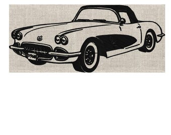 May include: Embroidered design of a classic convertible car in black and white. The car has a black roof, wheels, and details, with the year "1964" displayed on the front. The design is on a neutral-toned fabric.