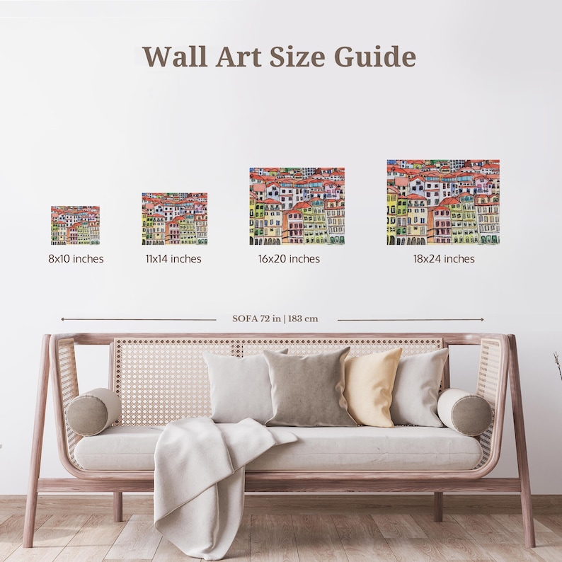 May include: A guide to wall art sizes with four different sizes of colorful building illustrations. The sizes are 8x10 inches, 11x14 inches, 16x20 inches, and 18x24 inches. The guide shows the art sizes above a light brown sofa with white cushions.