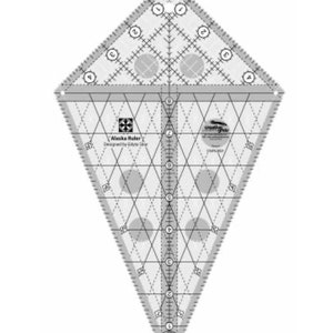 May include: A clear plastic quilting ruler with a diamond shape and a grid pattern. The ruler has markings in inches and includes a center line and circles. The ruler is labeled "Alaska Ruler" and "Creative Grids".