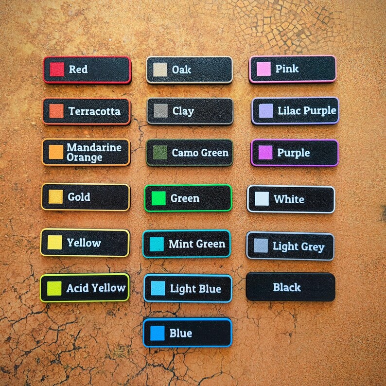 May include: A collection of rectangular color swatches, each labeled with a color name. Colors include red, orange, yellow, green, blue, and purple, among others. The swatches have black backgrounds and colored borders.