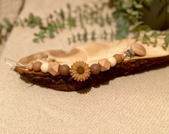 cadena de chupete con flor