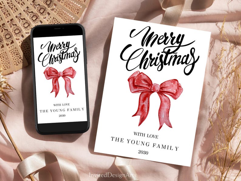 May include: A white Christmas card and a smartphone display the words "Merry Christmas" in elegant script, above a watercolor-style red bow. The card and phone also include the text "With Love, The Young Family, 2030."