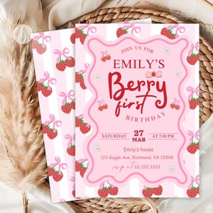 May include: Pink and white striped invitation with a pink and white strawberry pattern. The invitation says "Join us for Emily's Berry First Birthday" with a date of Saturday, March 27th at 2:00 PM. The invitation also includes an address and phone number.