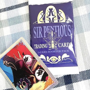 May include: A 7-card booster pack of "Sir Pentious Trading Cards" in a dark blue wrapper, with a silver-bordered trading card featuring a colorful illustration. The card has the word "Baxtious" on it. The background is a blue and white checkered pattern.