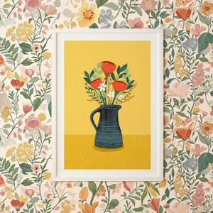 May include: A white framed print of a floral arrangement in a blue and white jug on a yellow background. The flowers are red and white.