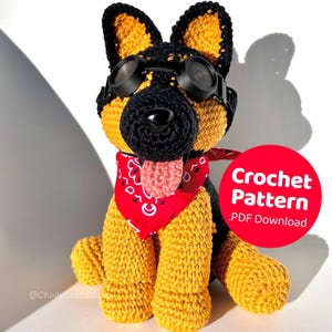 May include: A handmade crochet German Shepherd dog with black goggles, a red bandana, and a pink tongue. The dog is yellow and black. A red circle with the text "Crochet Pattern .PDF Download" is in the image.