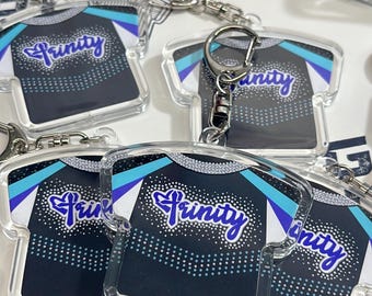 Cheerleading Keychains, Team Gifts for Cheer Team. Customized Cheer Uniforms turned into keychains.