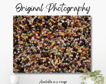 Original colour photograph of a close-up of a tray of multi-coloured glass beads, which creates a colourful and vibrant abstract mosaic.