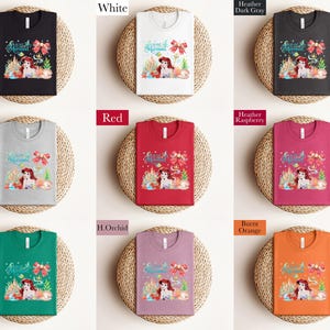 The image is a collage of nine different t-shirt designs, each with a unique color and style. The t-shirts are arranged in a 3x3 grid, with each row containing three shirts. The designs include a black t-shirt, a white t-shirt, a gray t-shirt, a red t-shirt, a pink t-shirt, a green t-shirt, a purple t-shirt, an orange t-shirt, and a brown t-shirt.
