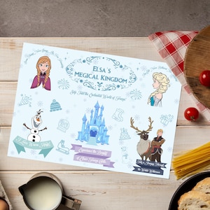 May include: A light blue placemat featuring characters and imagery from the movie "Frozen." The placemat includes illustrations of Anna, Elsa, Olaf, a castle, and the text "Elsa's Magical Kingdom."