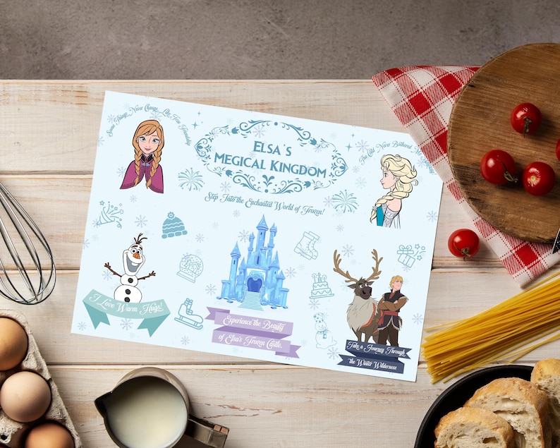 May include: A light blue placemat featuring characters and imagery from the movie "Frozen." The placemat includes illustrations of Anna, Elsa, Olaf, a castle, and the text "Elsa's Magical Kingdom."