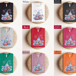 The image is a collage of nine t-shirts, each with a different color and design, arranged in a 3x3 grid. The t-shirts feature various patterns and colors, including black, white, red, green, purple, orange, and pink.
