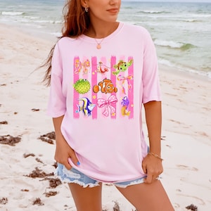 Findet Nemo Shirt, Dory Nemo Spritz-T-Shirt, Disney Strand-Sommer-Shirt, Ozeanfreunde Schleifen-T-Shirt, Rosa Mädchen Sommerurlaubs-Shirt Geschenk