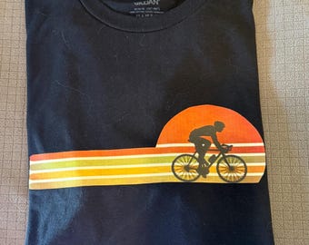 Road cyclist riding into the sun set t shirt. 80’s style
