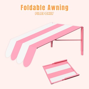 May include: A pink and white striped foldable awning with the text "Foldable Awning FILES ONLY" in orange and white. The awning is supported by a pink metal frame. A smaller, folded version of the awning is also visible.