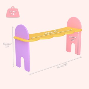 May include: A colorful wooden bench with a scalloped yellow top, supported by pink and purple legs. The bench is 12 inches long, 6.4 inches high, and the top is 10.7 inches wide. The bench weighs 5 lbs.