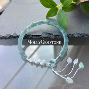 May include: A set of three ceramic nesting bowls in shades of blue, green, and white. The bowls have a speckled glaze and a simple, modern design. The largest bowl is about 15 cm in diameter.