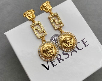 Orecchini pendenti vintage Versace con strass dorati