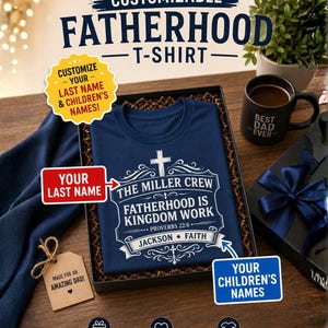 May include: A navy blue t-shirt inside a gift box featuring a white graphic print with a cross, the text THE MILLER CREW, FATHERHOOD IS KINGDOM WORK, PROVERBS 22:6, and the names JACKSON and FAITH, accompanied by a black mug with BEST DAD EVER text.