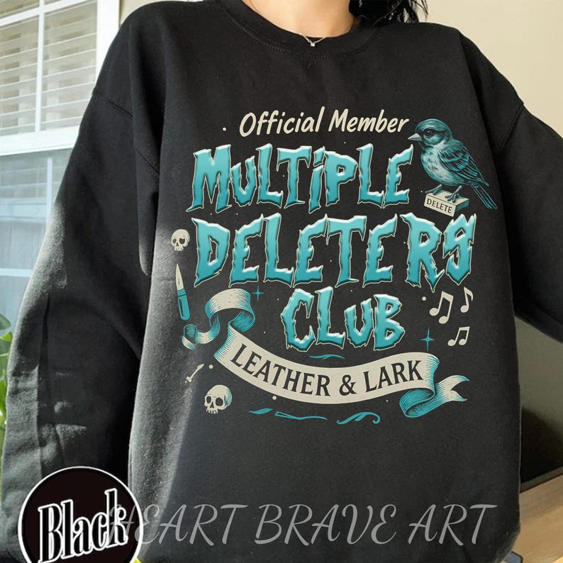 May include: Black sweatshirt with a blue and white graphic design that says "Official Member Multiple Deleters Club Leather & Lark". The graphic also includes a bird, musical notes, and a skull.