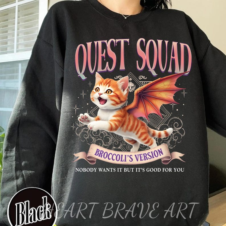 May include: Black sweatshirt with a graphic of a cat with wings. The text "QUEST SQUAD" is at the top of the graphic and "BROCCOLI'S VERSION" is below the cat. The text "NOBODY WANTS IT BUT IT'S GOOD FOR YOU" is at the bottom of the graphic.
