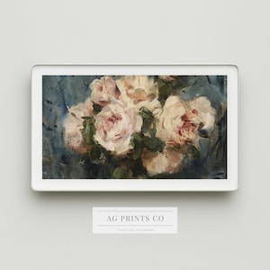 May include: A framed floral art print featuring a bouquet of light pink and white roses with green leaves against a blue background. The artwork is displayed in a white frame. The text "AG PRINTS CO" is visible at the bottom.