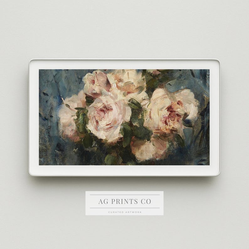 May include: A framed floral art print featuring a bouquet of light pink and white roses with green leaves against a blue background. The artwork is displayed in a white frame. The text "AG PRINTS CO" is visible at the bottom.