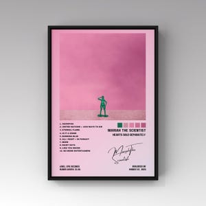 May include: A framed poster with a pink background features a green toy soldier. The poster includes the album title "HEARTS SOLD SEPARATELY" by Mariah the Scientist, along with a tracklist and release date.