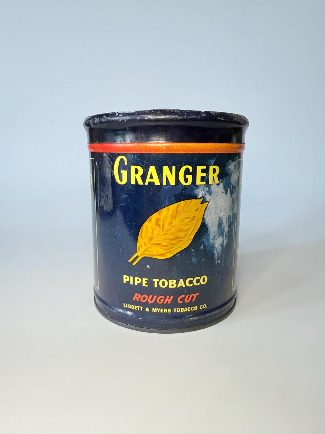 granger pipe tobacco I've smoked on and off for years but never really payed too much attention to the tin. They are missing a prime opportunity to change rough cut to ruff cut lmao 1928 Ad Granger Rough Cut