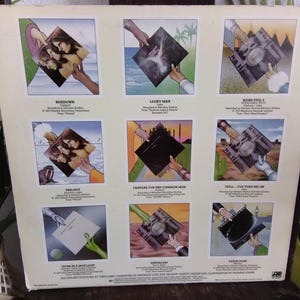 May include: Album cover featuring nine square illustrations of album art. Each illustration shows a hand holding the album. The album art includes images of people, landscapes, and abstract designs. Text is present on the album cover.