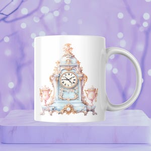 May include: White ceramic mug with a blue and gold ornate clock design. The clock face has Roman numerals and black hands. The mug has a white handle.