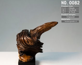 May include: A handcrafted wooden sculpture, featuring intricate textures and a natural, organic form. The sculpture is approximately 13 inches long, 12.6 inches wide, and 6.7 inches high, with a weight of 9.6 pounds. The base is a dark, rectangular shape. The text "ZAVISSEN CO NO. 0082" is visible.