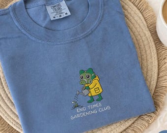 End Times Gardening Club Embroidered Comfort Colors® Shirt, Cozy Apocalypse Frog Critter Shirt, Funny Cottagecore Survival Shirt