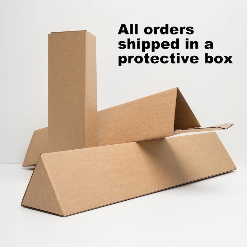 May include: Cardboard shipping boxes in various shapes and sizes. The boxes are made of brown corrugated cardboard and are designed to protect items during shipping. Text on the image reads "All orders shipped in a protective box."