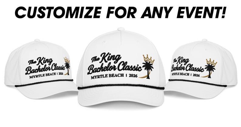 May include: Three white baseball caps with black rope trim across the brim. Each cap features black embroidered text reading The King Bachelor Classic and MYRTLE BEACH | 2026, with a black palm tree and a gold crown icon. Text above reads CUSTOMIZE FOR ANY EVENT!
