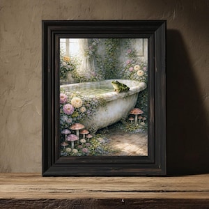 May include: A framed art print depicts a whimsical scene of a vintage bathtub filled with water, surrounded by flowers and mushrooms. A green frog sits on the edge of the tub. The artwork is framed in a dark wood frame and set against a rustic background.