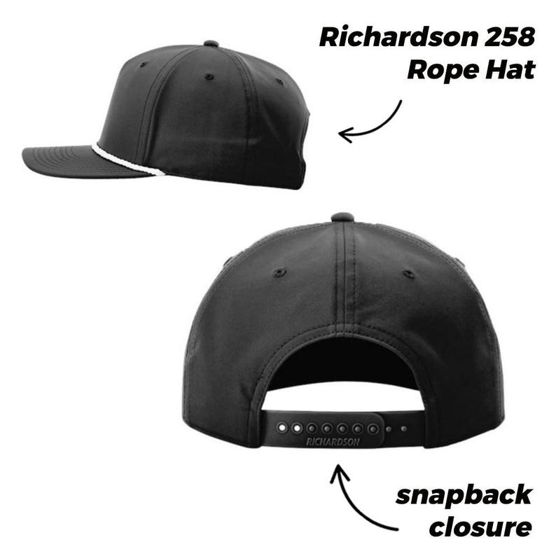 May include: A black Richardson 258 rope hat featuring a white rope detail across the base of the crown and a black plastic snapback closure at the rear. The hat is shown from a side profile and a rear view, highlighting the adjustable strap.