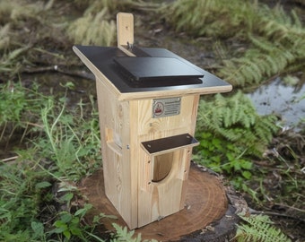 Nesting box with camera, solar, battery and heating half cave