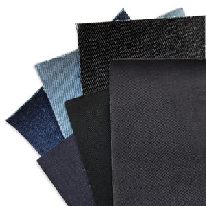May include: Five different swatches of denim fabric in various shades of blue and black. The swatches are arranged in a fan shape, with the darkest shade at the top and the lightest shade at the bottom.