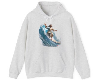 surfer jesus surfing a huge wave, happy jesus surfs, cool jesus, funny jesus humour, fun jesus wave, jesus surf hoodie top by inferno