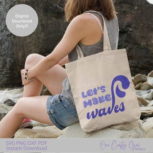 May include: A beige tote bag with the words "Let's make waves" in purple script and a wave graphic. The bag is held by a person sitting on rocks near the sea. The words "Digital Download Only!!!" are in a white circle.