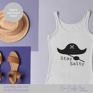 May include: A white vest top featuring a black pirate hat design and the words "Stay Salty". A straw hat and brown sandals are also visible. The image includes the text "Digital Download Only!!!".