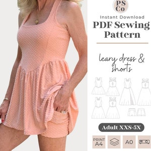 May include: A PDF sewing pattern for a leary dress and shorts. The pattern is available in sizes XXS-5X and can be printed on A4 or AO paper. The image shows a model wearing a pink dress with white polka dots.