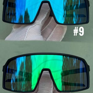 May include: Two pairs of black-framed sunglasses with mirrored lenses. One pair has blue lenses, the other green. The sunglasses have a distinctive, sporty design. The numbers "#9" and "#4" are printed on the image.